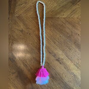 Pink tri-color beaded tassel necklace.